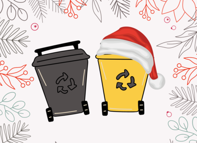 Eine schwarze und eine gelbe Mülltonne auf weihnachtlichem Hintergrund